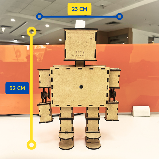 Front view of the assembled DIY wooden robot standing upright. The robot measures approximately 32 cm in height and 23 cm in width. The design features movable arms, sturdy legs, and a square-shaped head with engraved facial details. Dimension markers indicate the overall size of the finished model.
