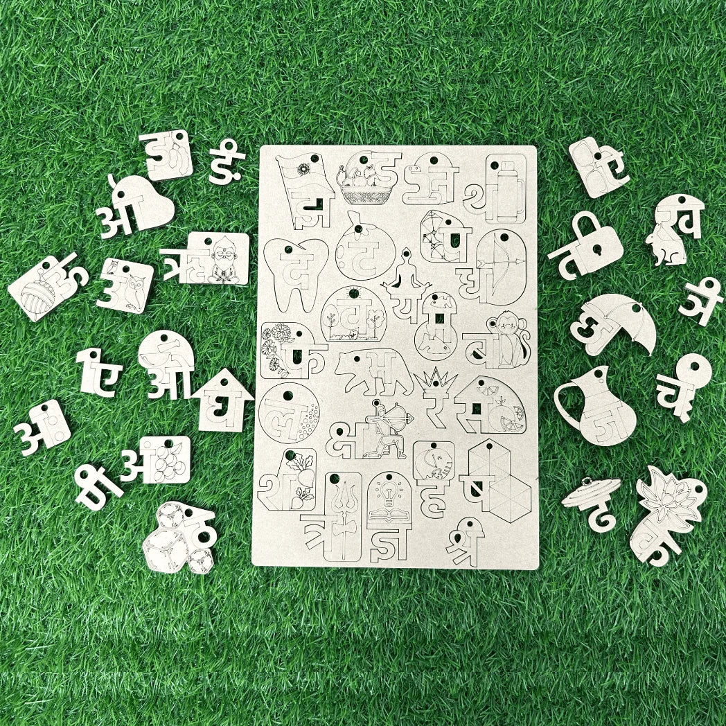 A wooden alphabet and number learning board with matching wooden cutout letters and numbers arranged around it on a green grass-like surface.