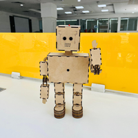   DIY clap sensor robot wooden model standing on desk, showing full assembled robot body with LED mounted on head

