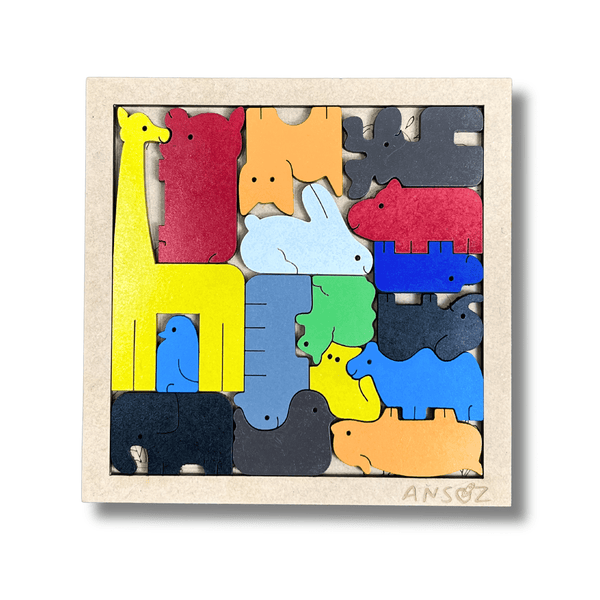 Close-up of wooden animal puzzle with hand placing animal shapes for problem solving skills.