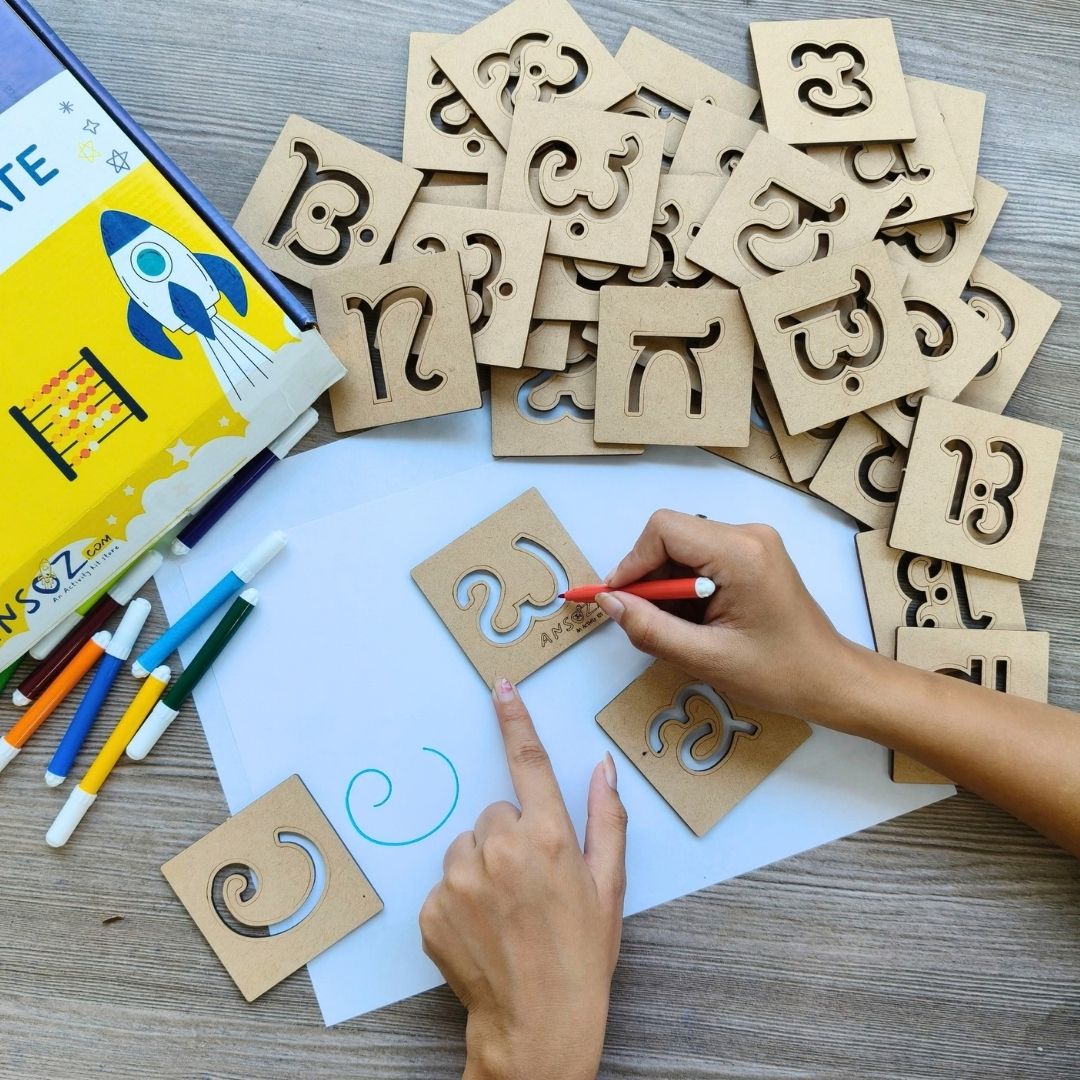 Kannada Vyanjana consonants stencils for kids 3+ being used for handwriting practice.