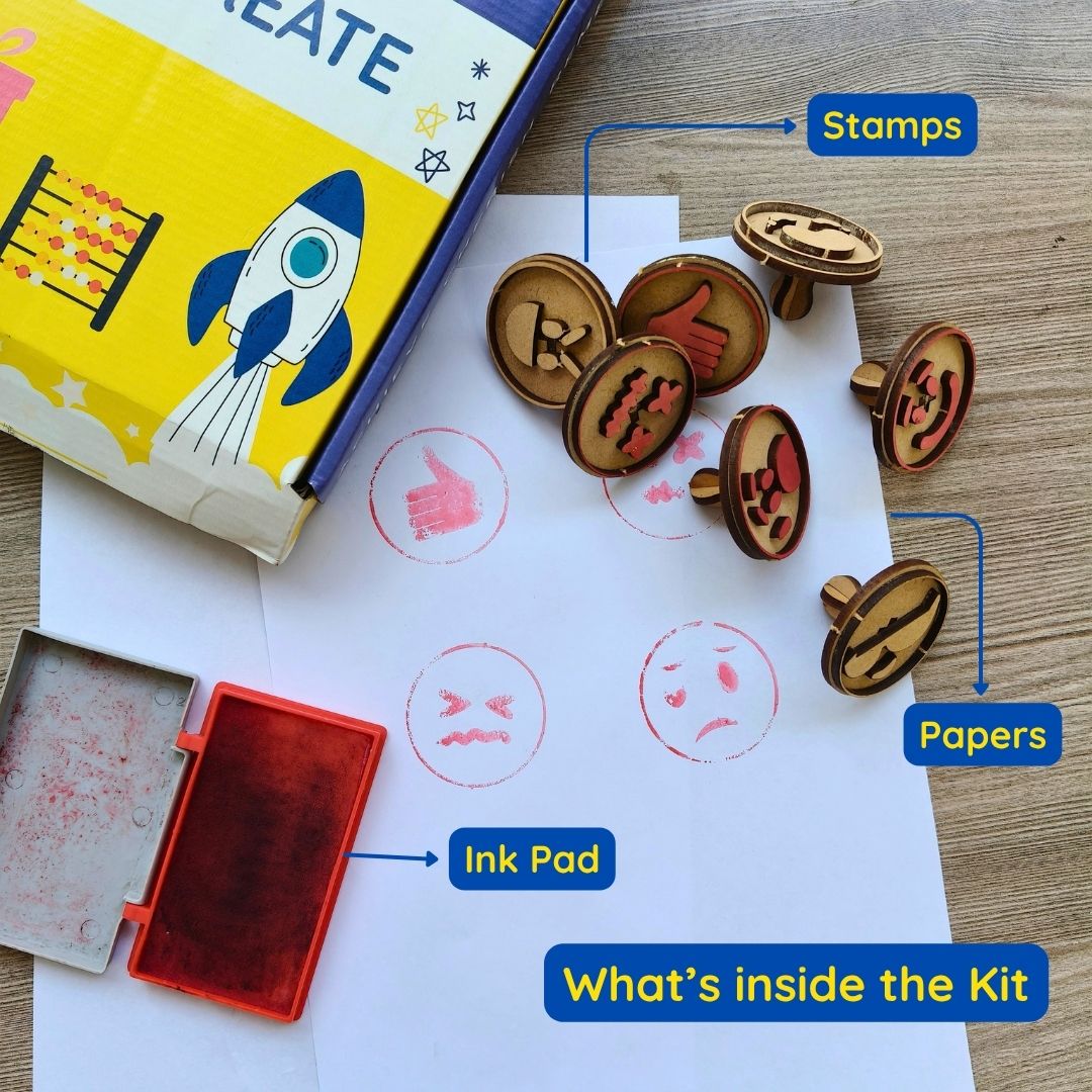 Emoji stamp kit with cute face stamps, ink pad and activity sheets for kids' DIY crafts.