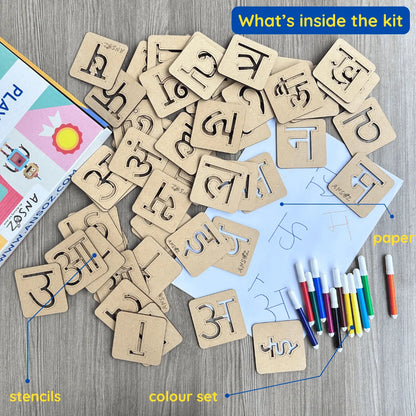 A children's alphabet learning kit spread out on a wood surface, including hindi letter stencils, box, colored markers, and paper with handwritten writing. A blue banner at the top reads 'What's inside the kit'.