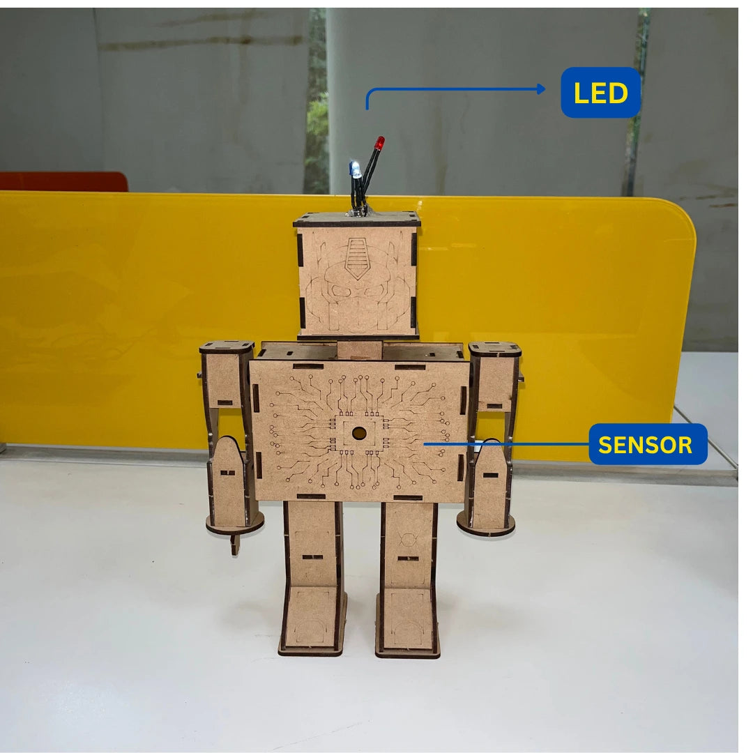 Mini robot toy showing LED light and sensor components.