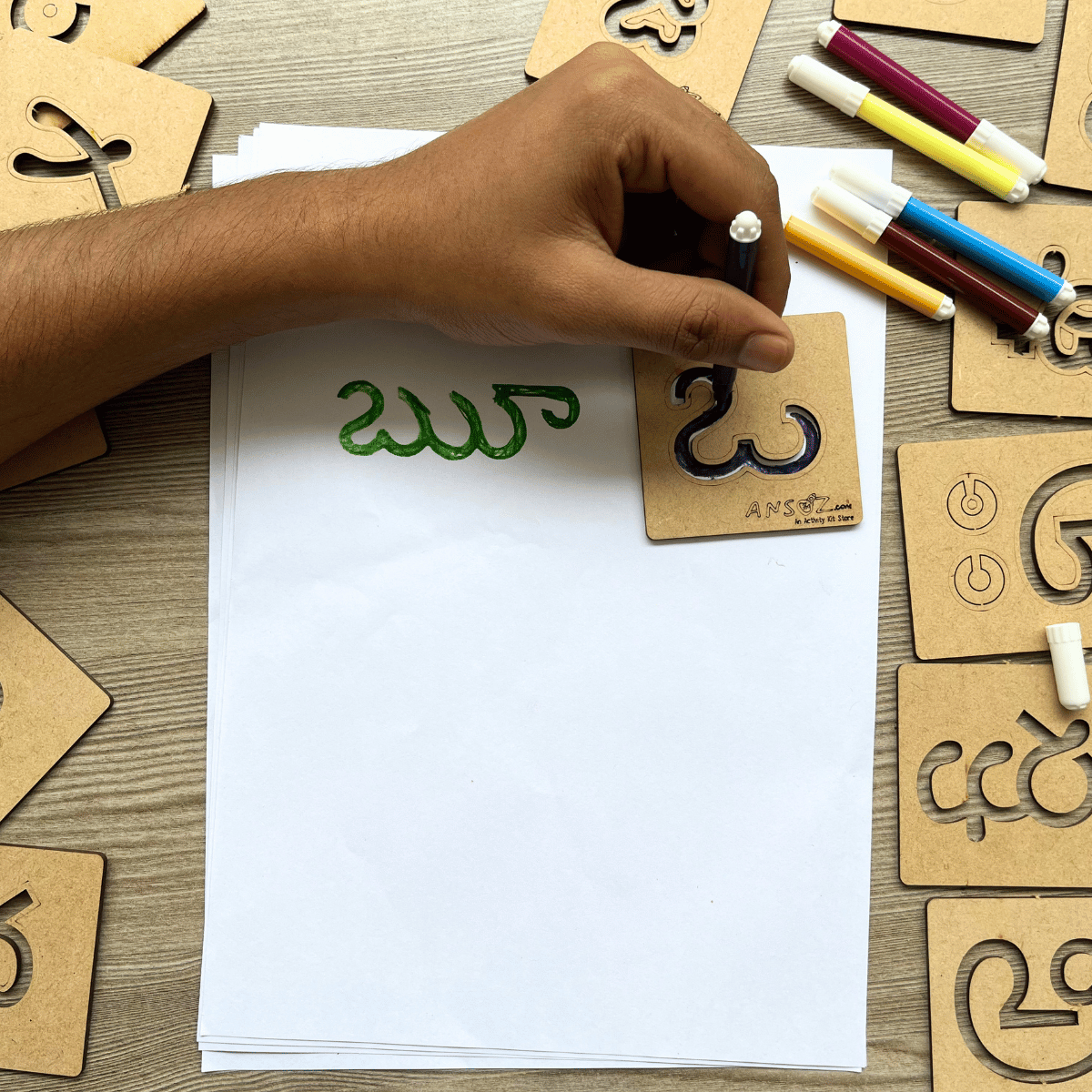 Wooden alphabet stencil kit used for Telugu handwriting practice
