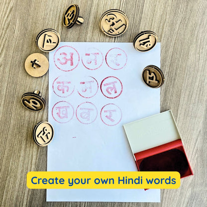 close view of wooden stamps showing english and hindi letters for kids learning 