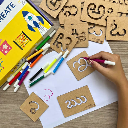 Kid practicing Telugu letters using stencil learning toy