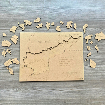 District pieces scattered around a wooden Andhra Pradesh map puzzle.