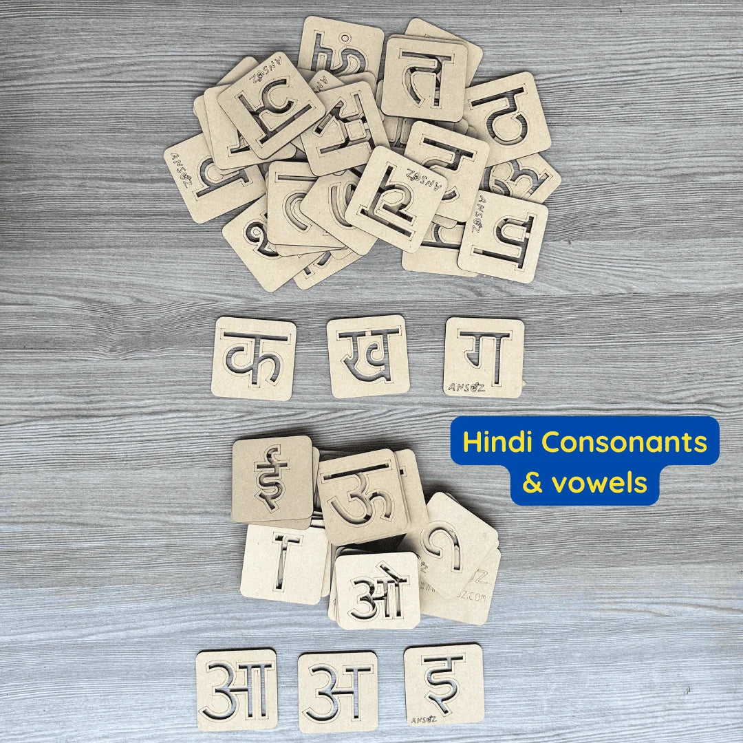 A set of wooden Hindi consonants and vowels stencil board arranged on a gray wood-textured background, with a blue text label reading 'Hindi Consonants & vowels'.