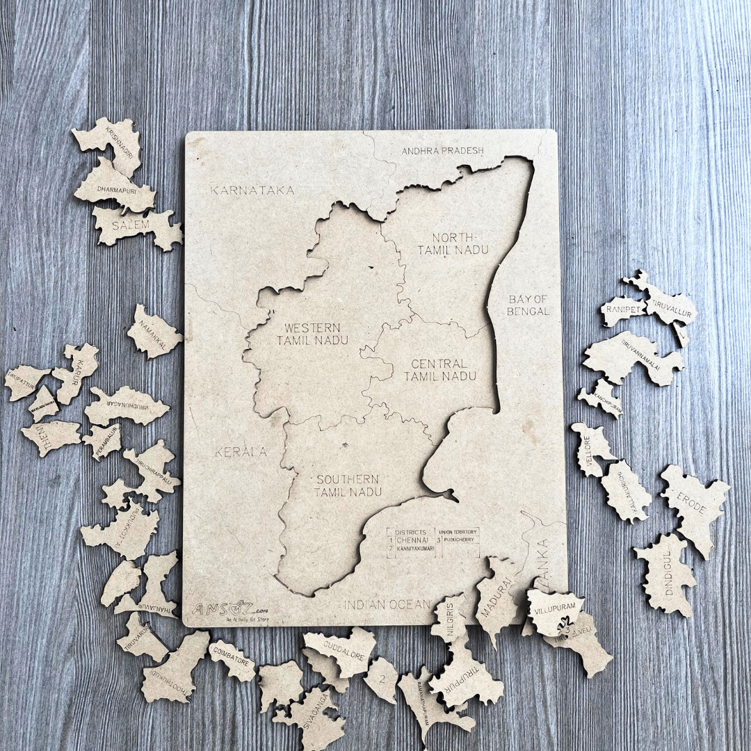 Tamil Nadu district map puzzle board with wooden pieces scattered, north to south regions