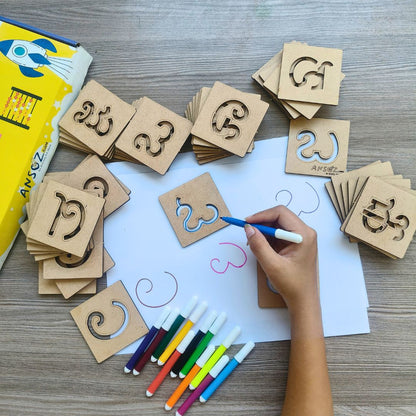 Kannada writing practice with wooden tracing stencils and colorful sketch pens.
