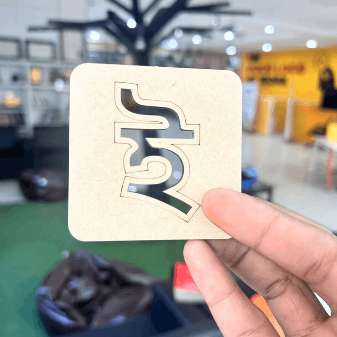  Close-up of a reusable 7 cm Assamese alphabet wooden stencil with smooth rounded edges, designed for safe handwriting practice and early language education for kids.