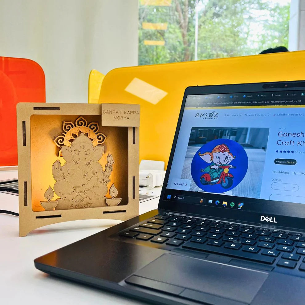 Wooden Ganesha activity box for kids displayed beside an online craft kit product page.