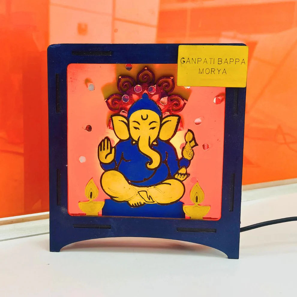 Hand-painted wooden Ganesha LED lamp, a completed diwali craft ideas for school project with Ganpati Bappa Morya nameplate.