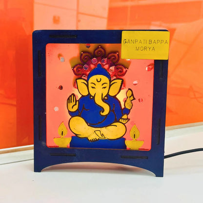 Hand-painted wooden Ganesha LED lamp, a completed diwali craft ideas for school project with Ganpati Bappa Morya nameplate.