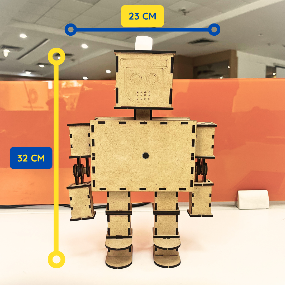 Front view of the assembled DIY wooden robot standing upright. The robot measures approximately 32 cm in height and 23 cm in width. The design features movable arms, sturdy legs, and a square-shaped head with engraved facial details. Dimension markers indicate the overall size of the finished model.