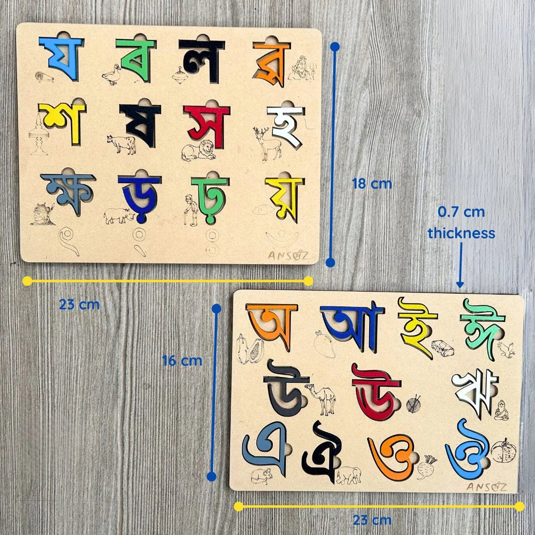 Two wooden Bengali alphabet puzzle boards shown on a gray wood-textured background, with blue and yellow measurement lines and text indicating dimensions and 0.7 cm thickness.