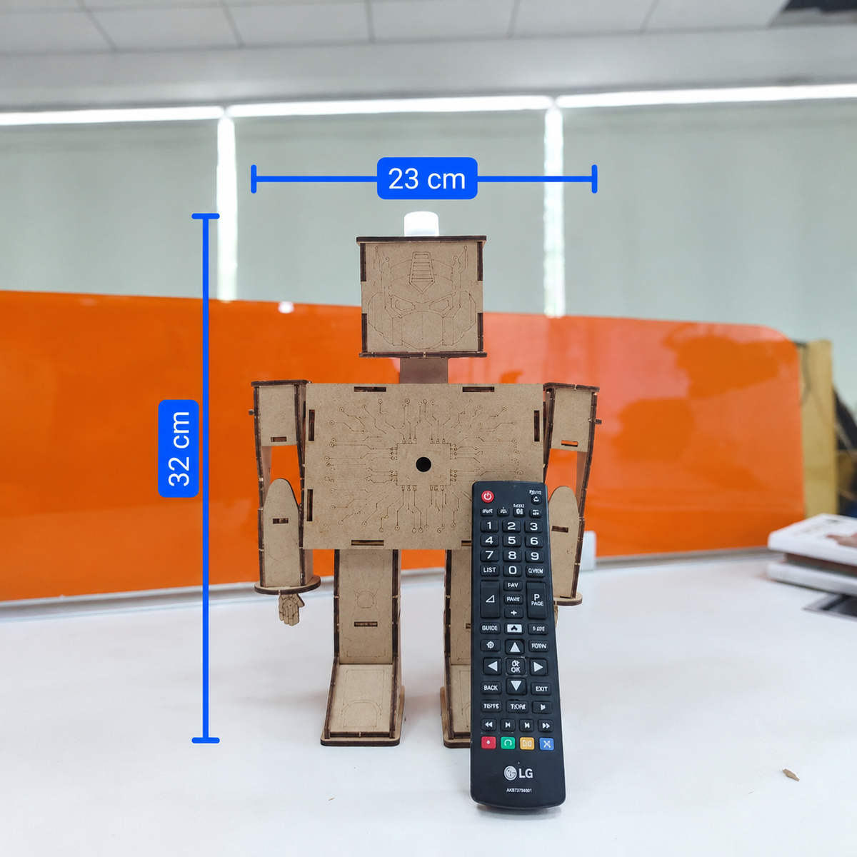 ANSOZ DIY Wooden Light Beam Control Robot Electronics Kit with TV Remote, measuring 23 cm wide and 32 cm tal.