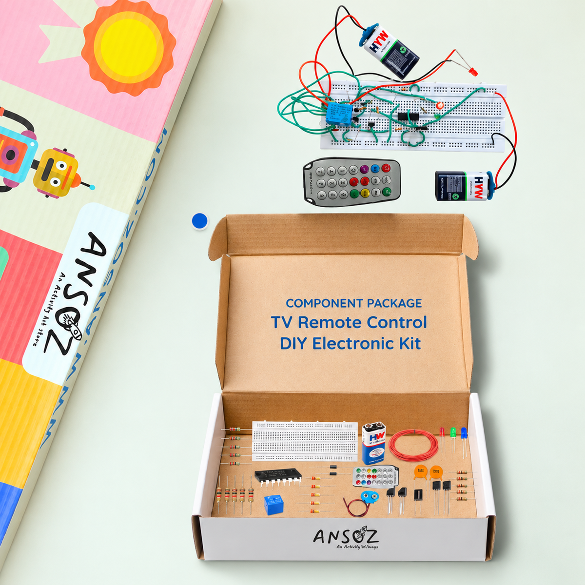 ANSOZ TV Remote Control DIY Electronics Kit featuring a breadboard circuit, TV remote, batteries, wires, and electronic components arranged alongside the component package box.