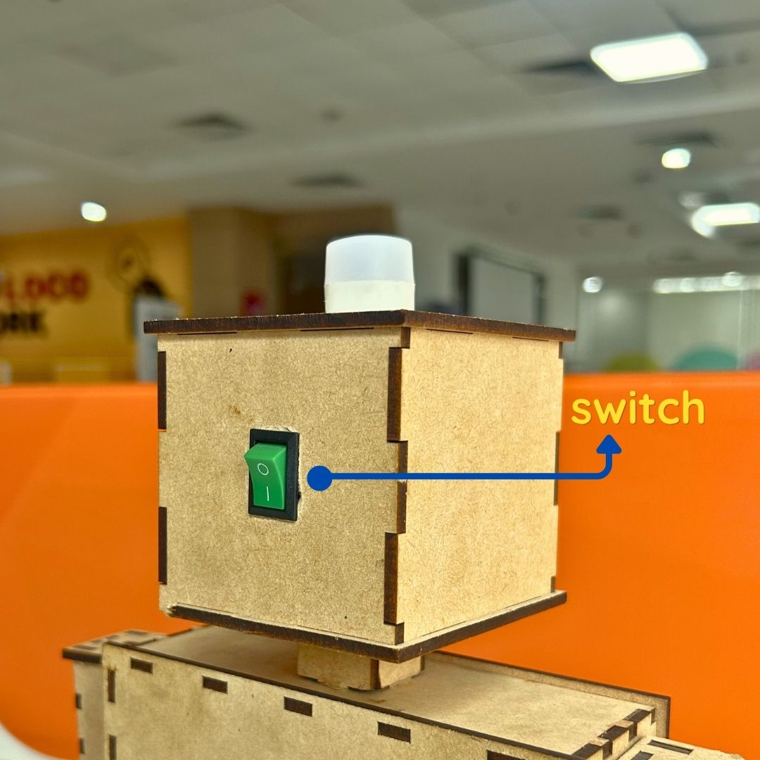 4.	Power switch on wooden robot touch sensor lamp for students