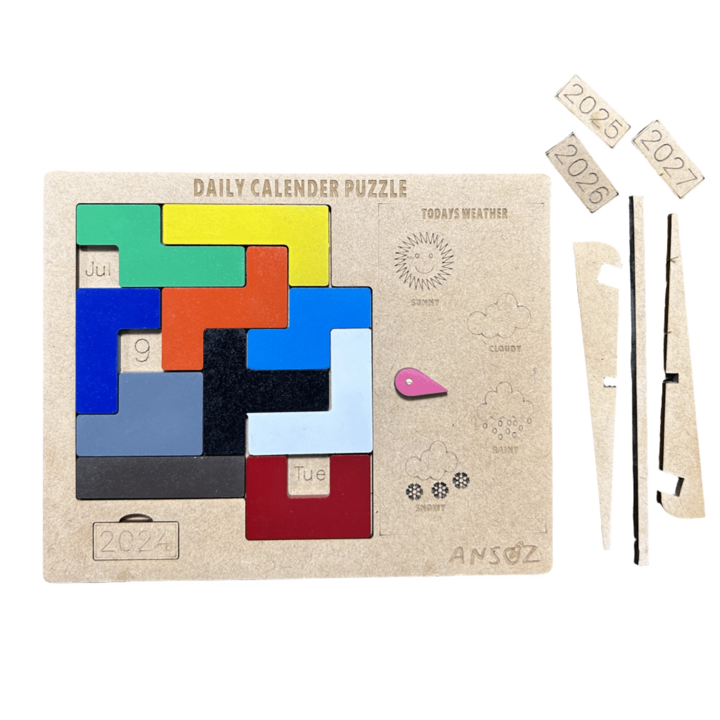 A wooden daily calendar puzzle set by Ansóz, featuring a beige wooden board with colorful geometric calendar pieces, weather icons, and separate wooden components including year tabs (2025, 2026, 2027), a ruler, and a black string, all displayed on a clean white background.