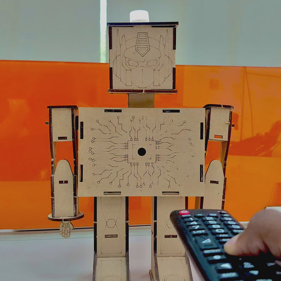 ANSOZ DIY Wooden Light Beam Control Robot Kit demonstrating on and off functionality using a TV remote.